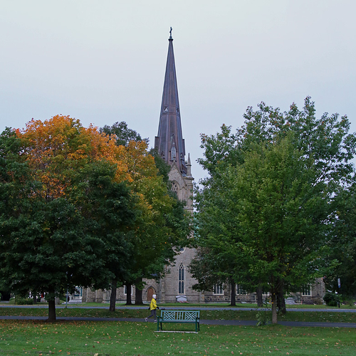 A morning walker strolls past Christ Church Cathedral in downtown Fredericton, NB.