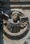 Façade portal, left spandrel roundel, seraph
