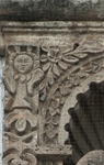 San Pedro, façade, second story niche (left) relief, cherub