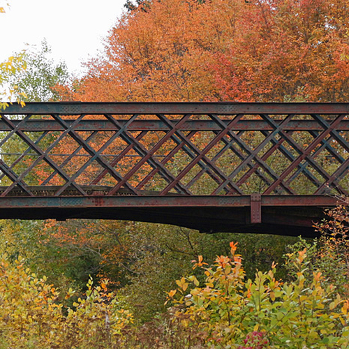 Now replaced, the old humpback bridge @ Hampton shows off it's unique design in contrast to autumn's hues.