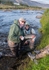 Mr Collings catches a grilse (helped by lovely guide Katka)