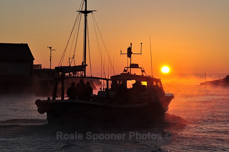 Fishing boat at Looe at sunrise as the mist rises - Looe