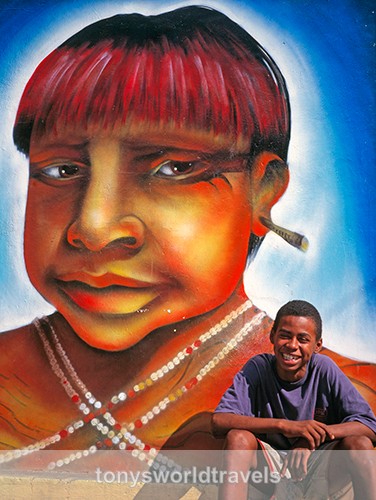 Portrait of a  Smiling Brazilian with a wall painting,  Rio, Brazil - Children