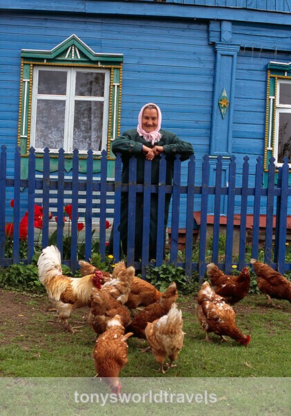 Russian Woman with her Chickens, Russia - Smiling faces of the World