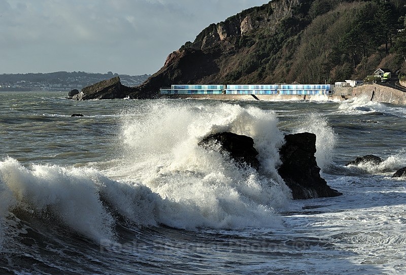 Large waves break over the rocks at Meadfoot Beach in Torquay  TQ rang - Meadfoot Beach Torquay