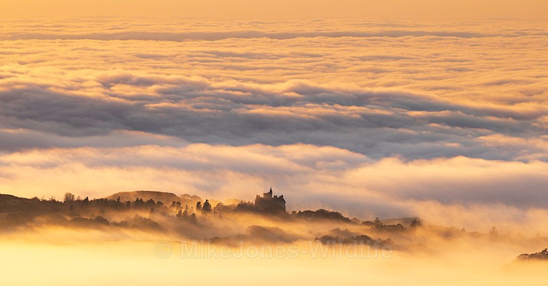 Glengorm Castle looking out over a sea mist at Sunset - Sea Mist, Moonset and Sunset over the Hebrides seen from the Isle of Mull