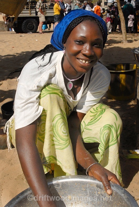 Senegal Fulani Village Fulani woman preparing food in bowl detail - Senegal Fulani Village