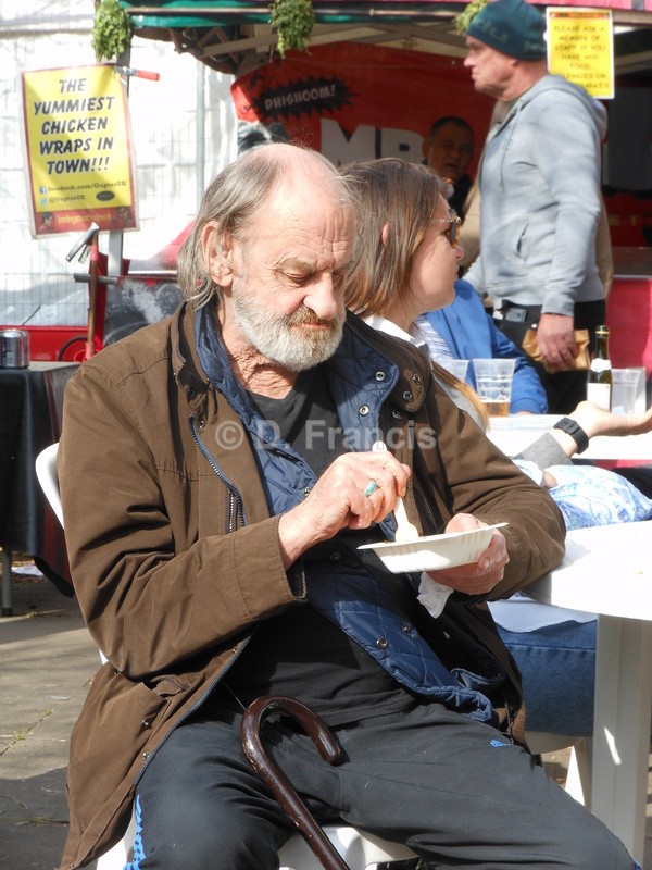 Man eating by food stall - Little Venice Cavalcade