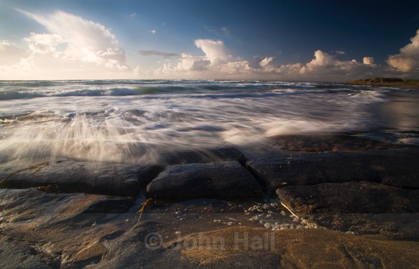 wave crashing on burren rocks,fanore beach,co. clare,ireland.