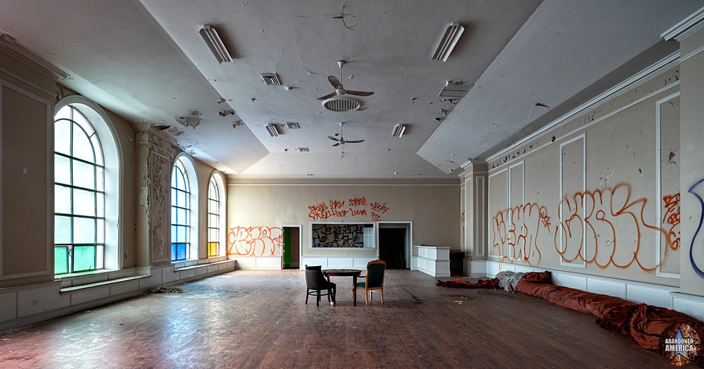Graffiti covered ballroom at the abandoned Logan Theater
