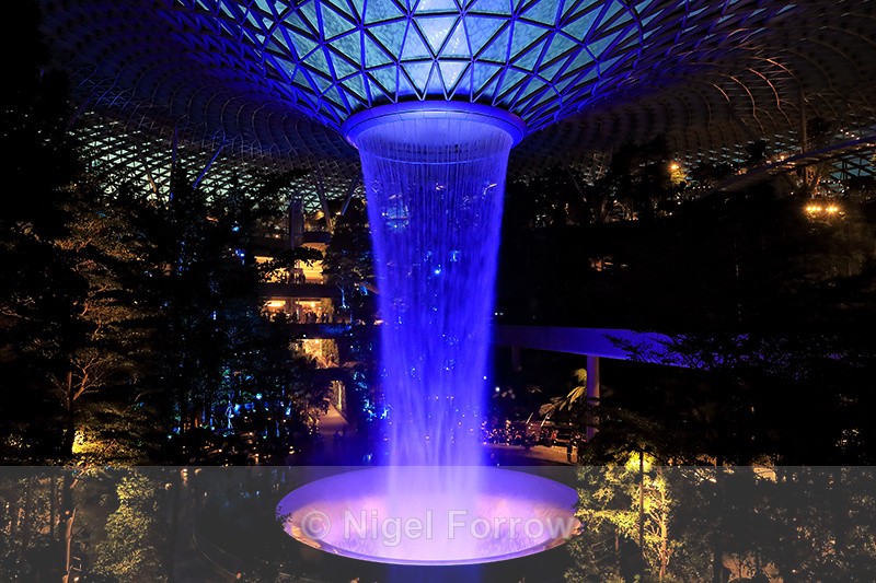 Rain Vortex illuminated blue, Jewel Changi Airport, Singapore - Singapore