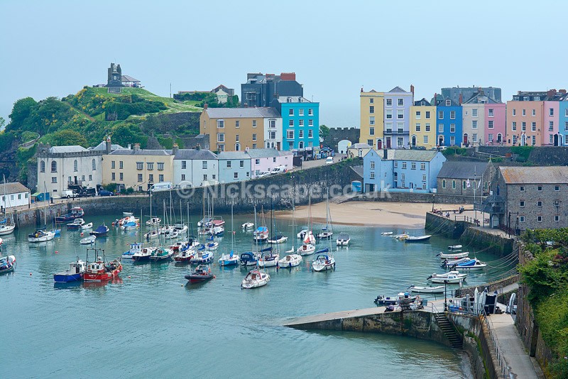 Photo of the famous Harbour at Tenby with Colourful Cottages and Boats