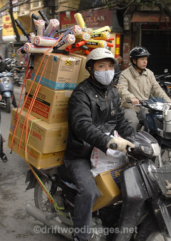 Moving goods by motorbike, Hanoi, Vietnam - South East Asia