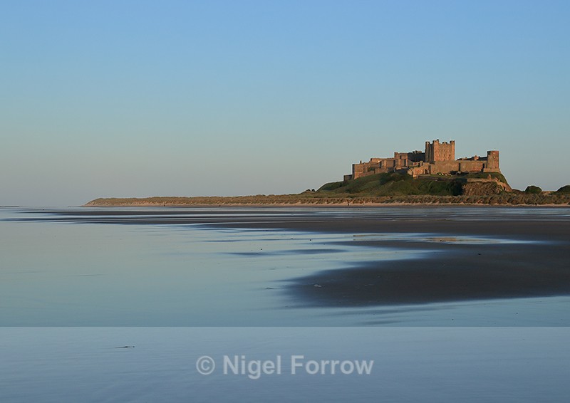 Bamburgh Castle at sunset, Northumberland - Northumberland, England