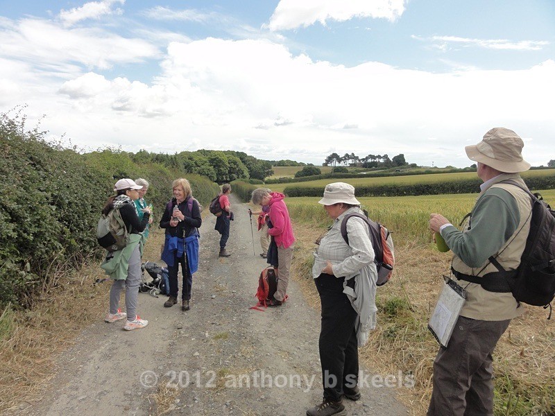 063 Off-loading layers and a drinks stop Sunrise Farm ahead - York Minster Walkers Collection 2024