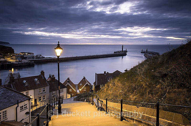 Night time landscape photograph of the 199 steps at Whitby Abbey on the north Yorkshire coasty