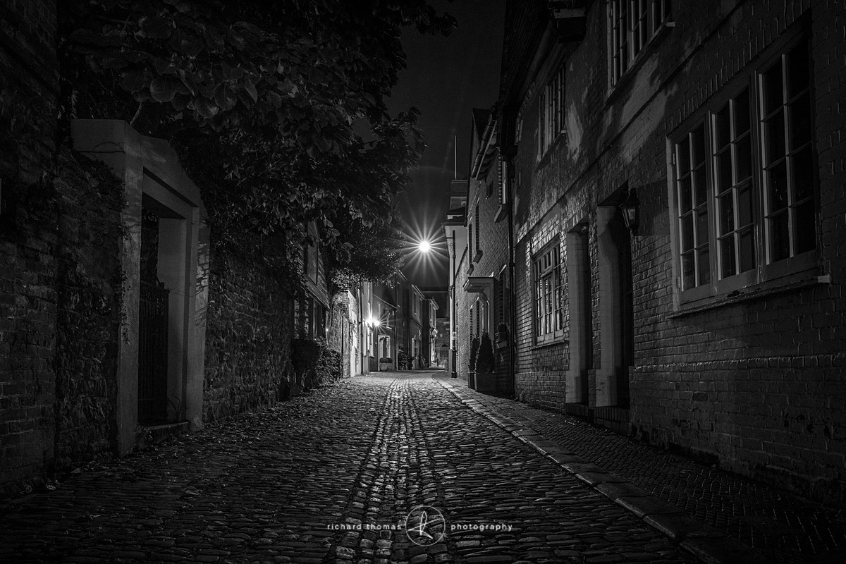 A cobbled street in Petworth Sussex at night