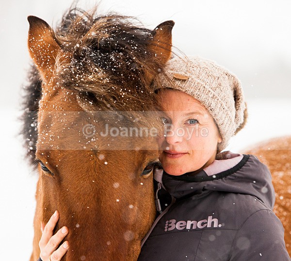 close up of lady and bay pony in snow - Equine Gallery Portfolio