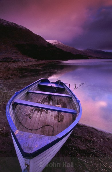 boat on lake at sunrise,black valley,co. kerry,ireland.