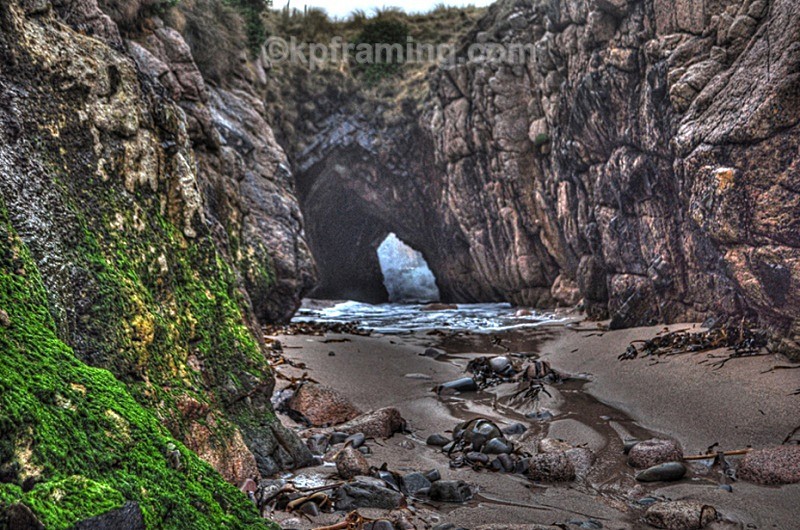 cave with swell aproching under the 5 th hole - pictures of cruit island golf course caves beaches and owey&Arranmore Island)