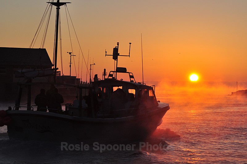 A fishing boats leaving Looe at sunrise on a winter morning - Looe