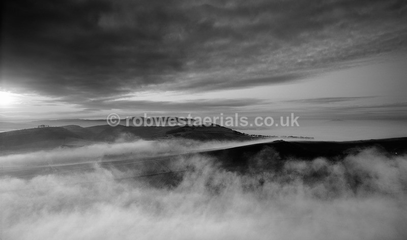 North Fife hill misty sunset in Scotland in black and white