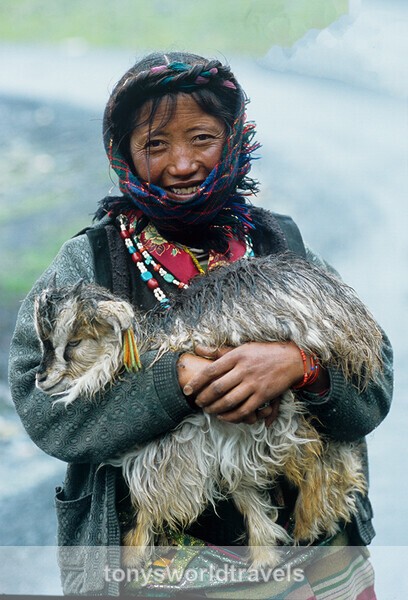 Tibetan woman with Goat, Tibet - Smiling faces of the World