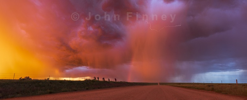 Sunset thunderstorm with rainbow and lightning. - Weather photography