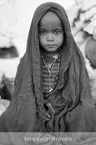 Child in blanket, Delhi, India - Children