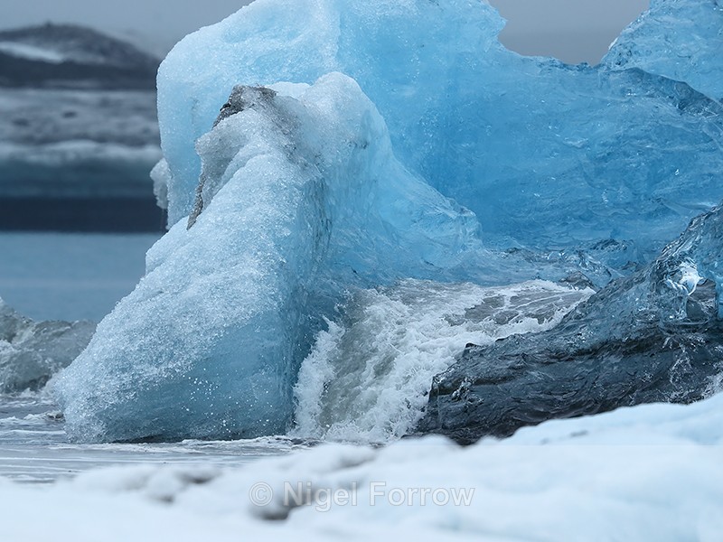 Waterfall on blue iceberg, Jokulsarlon, Iceland - Iceland