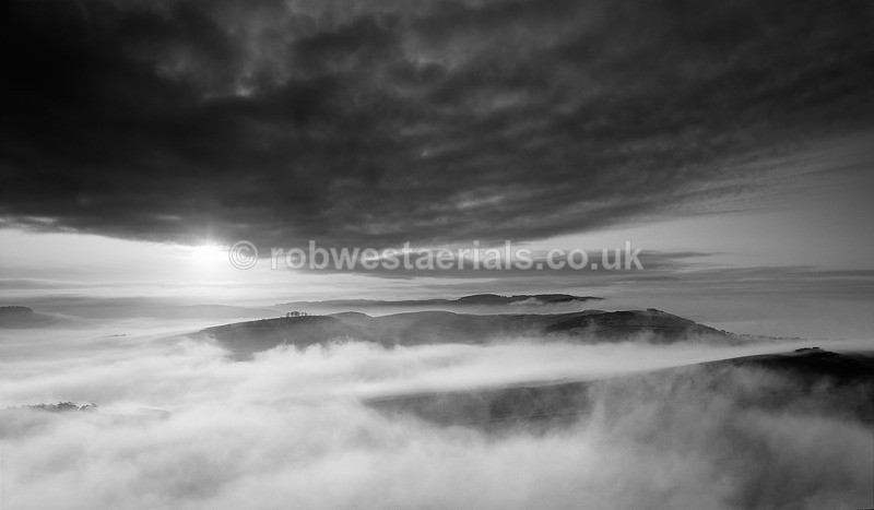 North Fife hill misty sunset in Scotland in black and white