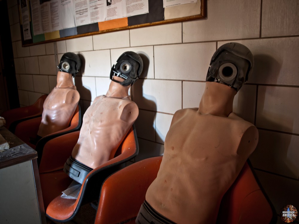 Faceless CPR dummies sit in a darkened corridor in a former Oak Hill Youth Center building