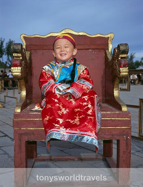 Smiling boy as a Chinese Emperor in the Forbidden City, Beijing, China - Smiling faces of the World