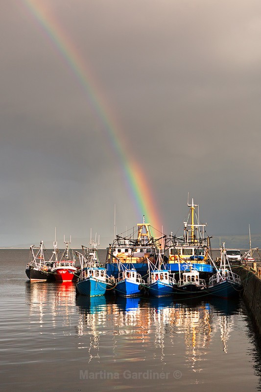 Rainbow over  Boats at Carrickarory Pier - Ireland by Day