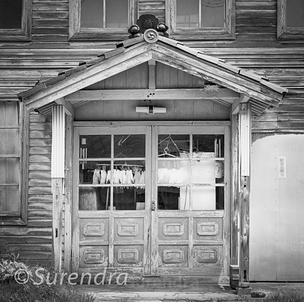 Doorway with Gloves - Japanese buildings in decline