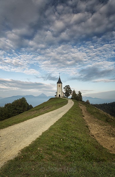 Clouds & Jamnik Church, Kranj, Slovenia.