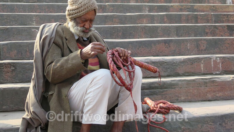 Delhi Jama Masjid man sitting on steps - Delhi