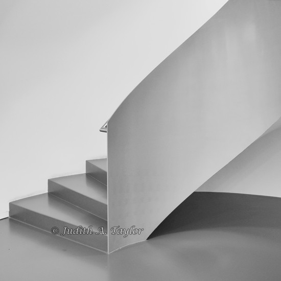 The bottom of a spiral staircase.