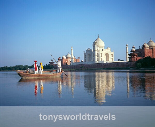 Boatman and  children with Taj Mahal - India