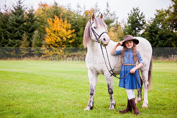 grey pony and girl in cowgirl outfit - Equine Gallery Portfolio