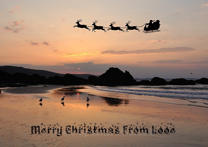 LO98 Santa passes over Looe Beach at sunrise - XMAS CARDS Looe Polperro and General Cornwall