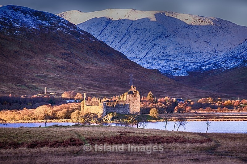 Kilchurn with a snowy background on a sunny day - Snowy Photos in Argyll