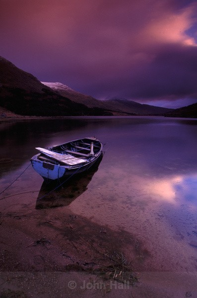 boat on lake at sunrise,black valley,co. kerry,ireland.