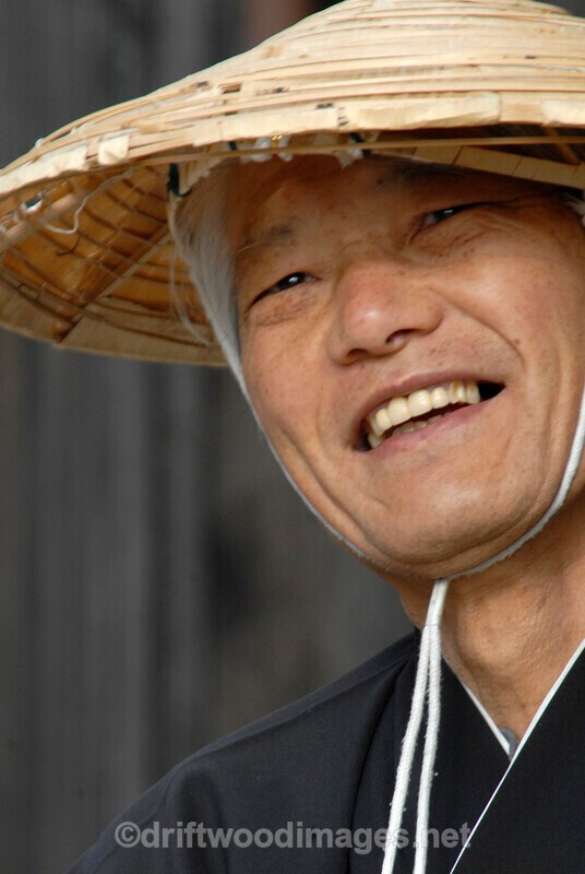 Japan Nagasaki Japan Dejima man in coolie hat 3 smiling - Japan
