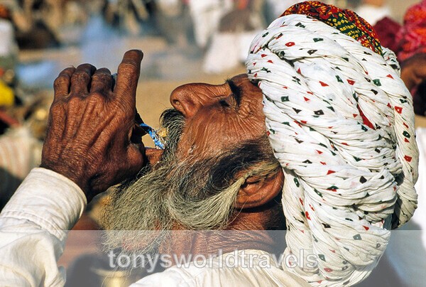 Rajastani Man drinking water, India - India