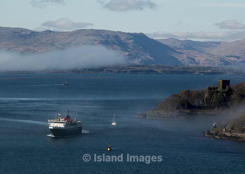 Sea mist hanging around Dunollie Castle capturing the Ferry to Mull. - Oban