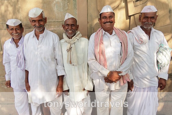 Five smiling men in Nerhu style Cloths India - Smiling faces of the World