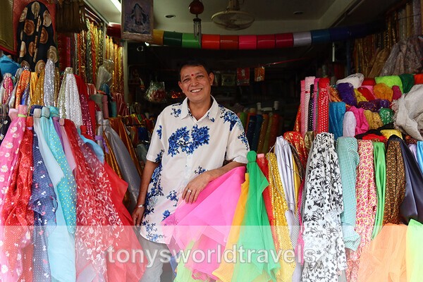  A Smiling Textile Seller in a Shop Little India Chinatown Phahurat Ba - Smiling faces of the World