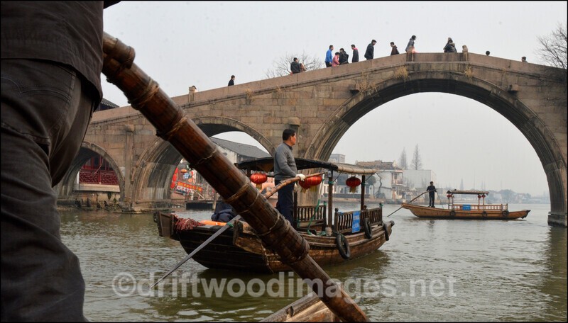 China Shanghai Zhujiajiao Water Town bridge from boat - China