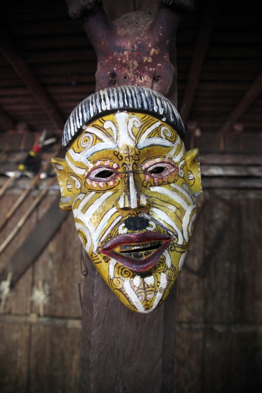 A traditional Iban mask hung up in a longhouse in Sarawak, Borneo